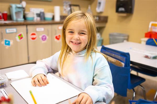 Students inside their classrooms learning. 
